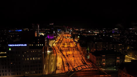 Aerial-view-toward-the-train-station,-winter-night-in-downtown-Tampere,-Finland
