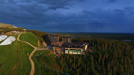 Aerial-view-around-the-Hotel-Levi-Panorama-resort,-summer-evening-in-Lapland,-Finland---orbit,-drone-shot
