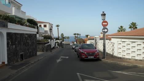 View-of-a-narrow,-one-way-road-in-Los-Gigantes-town
