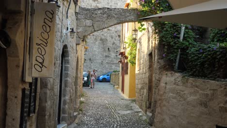 Tourist-family-between-stone-buildings-in-the-Old-Town-of-Rhodes