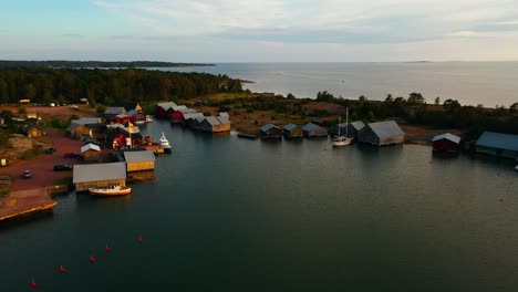 Aerial-view-around-the-famous-Karingsund-harbor,sunset-in-Eckero,-Aland,-Finland---circling,-drone-shot