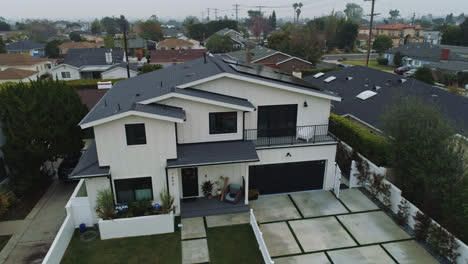 Aerial-view-around-suburban-house-with-solar-panels-on-the-roof---orbit,-drone-shot