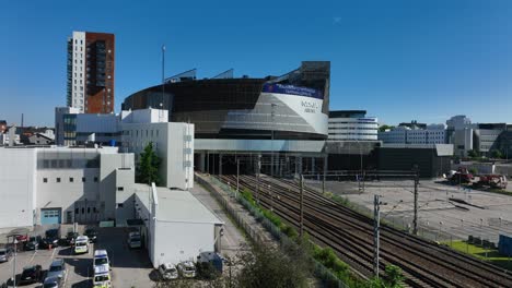 Aerial-view-in-front-of-the-Nokia-Arena,-summer-in-Tampere,-Finland---rising,-drone-shot