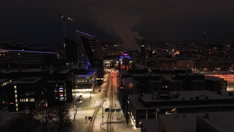 Aerial-view-over-the-Kalvantie-street-towards-Ratina,-winter-evening-in-Tampere,-Finland
