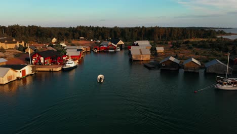 Aerial-view-of-a-boat-arriving-at-the-Karingsund-harbor,-in-Eckero,-Aland,-Finland