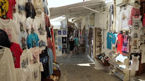 People-in-a-narrow-street-of-Lindos,-Part-three