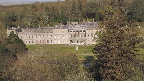 Aerial-of-the-grand-glynllifon-mansion-estate-tracking-from-far-away-towards-the-front-entrance