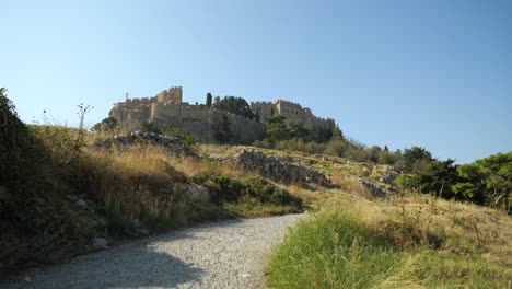 Low,-wide-angle-shot-of-the-Acropolis-in-Lindos-on-a-sunny-day