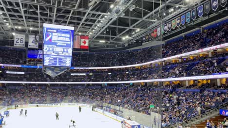 Ice-Hockey-Fans-Cheering-During-Game-Intermission-At-An-Indoor-Ice-Rink-Arena