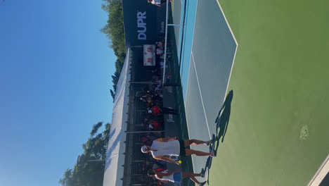 People-playing-pickleball-at-the-MLP-tournament,-in-Newport-beach,-California,-USA-Vertical-view