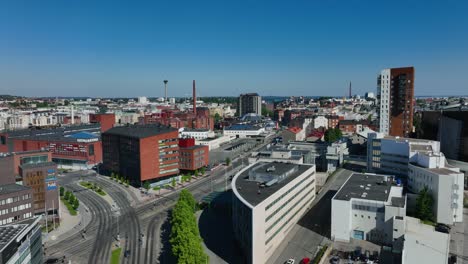Aerial-view-of-the-cityscape-of-Tampere,-sunny-summer-day-in-Pirkanmaa,,-Finland---tracking,-drone-shot
