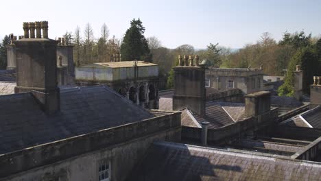 Aerial-over-the-conservatory-and-roof-of-a-dilapidated-mansion-that-is-under-repair