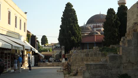 Streetview-of-the-Old-Town-of-Rhodes-with-Mosque-of-Suleiman-at-golden-hour