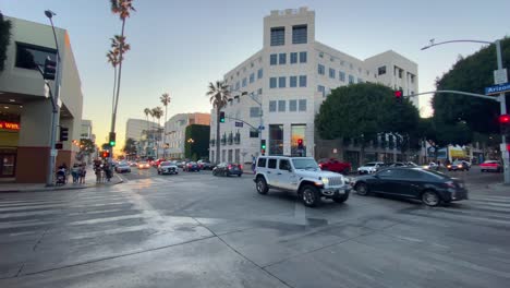 Traffic-in-downtown-Santa-Monica,-sunny-evening-in-Los-Angeles,-USA---static-view