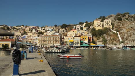 View-of-the-colorful-harbour-and-houses-on-the-hill-in-Ano-Symi