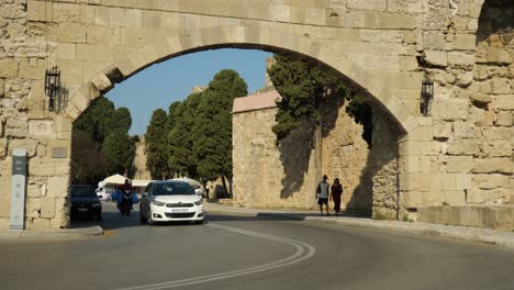 Cars-and-motorbikes-going-through-the-gate-of-Rodos-Town