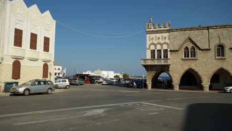 Streetview-with-the-Mediterranean-Sea-in-background,-Rodos-Town