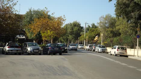 Typical-street-view-with-car-approaching-in-Rodos-Town