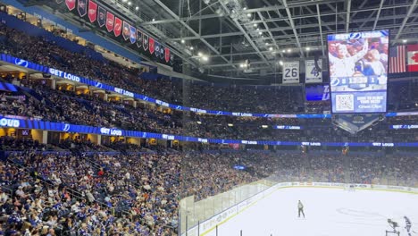 Ice-Hockey-Fans-Cheering-During-Game-At-An-Indoor-Ice-Rink-Arena