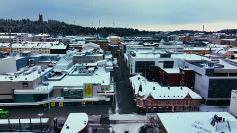 Aerial-view-over-the-Asemakatu-street,-gloomy,-winter-evening-in-Jyvaskyla,-Finland