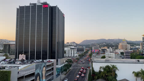 CNN-Office-Building-In-Los-Angeles-with-the-Hollywood-Sign-in-the-Distant-Background,-California,-USA---wide