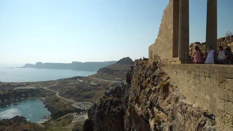 Partial-view-of-Lindos-Acropolis-on-the-cliffs,-Saint-Paul's-Bay-in-background