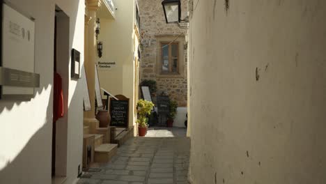 Woman-walking-in-a-narrow-street-of-Lindos