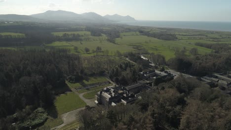 Aerial-over-the-grand-Glynliffon-estate-looking-out-towards-welsh-hills-and-the-sea