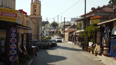 Car-approaching-in-a-quiet-greek-village,-Siana,-Rhodes