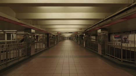 Long-empty-grim-subway-hall-during-covid-19