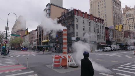 Smoky-Steam-pipe-and-manhole-on-corner-of-6th-and-14th-ave-in-NYC-slow-motion-during-Coronavirus