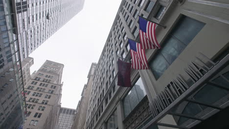 Birds-flying-over-American-flags-and-Manhattan-Mall-in-midtown-Manhattan-in-slow-motion