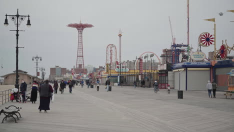 People-with-facemark-on-boardwalk-in-Coney-Island