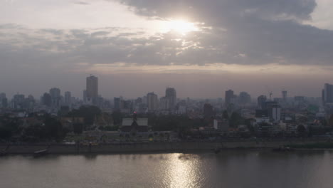 Sunset-on-polluted-Phnom-Penh-skyline-rack-focus