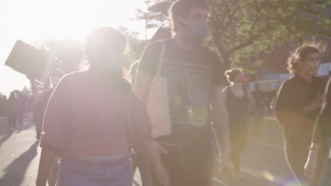 Crowd-of-protester-marching-in-the-street-of-Brooklyn-during-BLM-protest-with-lens-flare