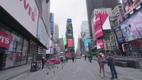 Wide-Empty-Time-Square-with-naked-cowboy-wearing-face-mask-during-coronavirus-outbreak