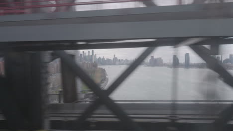 Shot-of-Nyc-Manhattan-skyline-from-moving-subway-Williamsburg-bridge