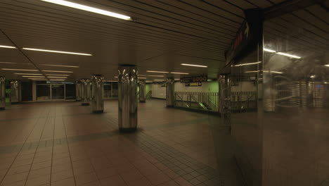 Slow-pan-right-on-grim-empty-subway-hall-during-covid-19