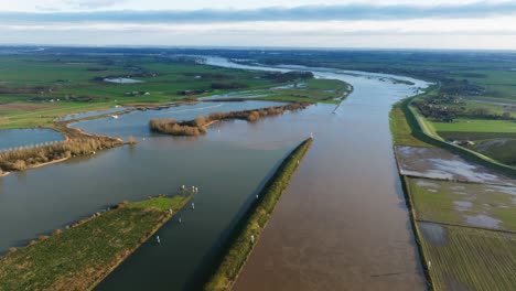 Drone-view-of-flooded-agricultural-fields-on-the-outer-banks-of-the-Lek-River,-Netherlands
