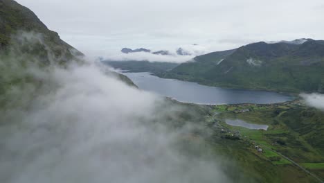 Aerial-above-Moving-Clouds-at-Fjords-and-Mountain-Landscape-in-Lofoten-Islands-Norway---4k
