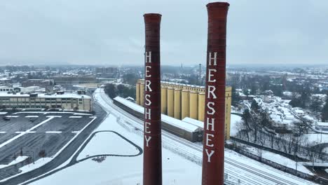 Aerial-shot-of-Hershey-Chocolate-smokestacks-in-the-snow