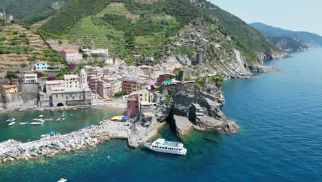 Cinque-Terre-Vernazza-Village-and-Boat-Tour-in-La-Spezia,-Liguria,-Italy---Aerial-4k-Circling