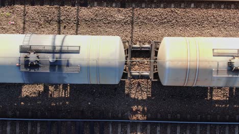 Freight-train-tankers-transporting-gasoline-aerial-top-down