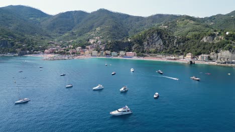 Boats-at-Monterosso-al-Mare-in-Cinque-Terre,-Vernazza,-La-Spezia,-Liguria,-Italy---Aerial-4k