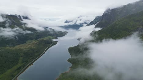 Aerial-View-Above-Moving-Clouds-at-Fjords-and-Mountain-Landscape-in-Lofoten-Islands-Norway---4k