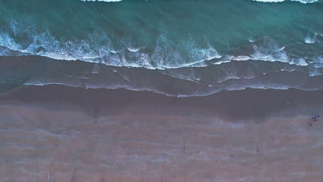 Overhead-view-of-waves-meeting-sand-at-Kund-Malir-Beach