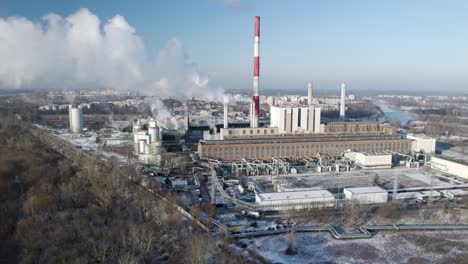 Aerial-view-of-a-heat-and-power-plant-with-smoking-chimneys-in-Warsaw,-Poland