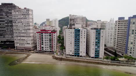 Aerial-shot-from-the-sea-towards-the-beach-and-São-Vicente-city-buildings
