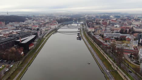Aerial-panorama-of-Vistula-river-with-bridges-and-Krakow-city-architecture