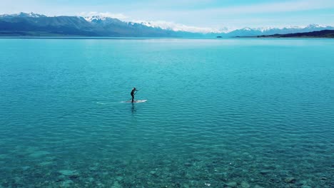 Adventurous-serenity:-Paddle-boarder-with-Mount-Cook-backdrop-in-captivating-stock-footage